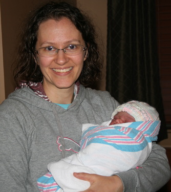 Erin Shell holding a sweet doula baby